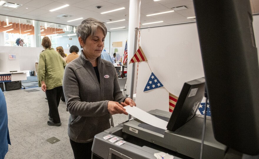 Christine Ecker votes on March 3 in Charlotte, N.C., the last day of early voting ahead of Super Tuesday. The state is one of 16 holding contests on the biggest primary election day of the 2024 cycle.