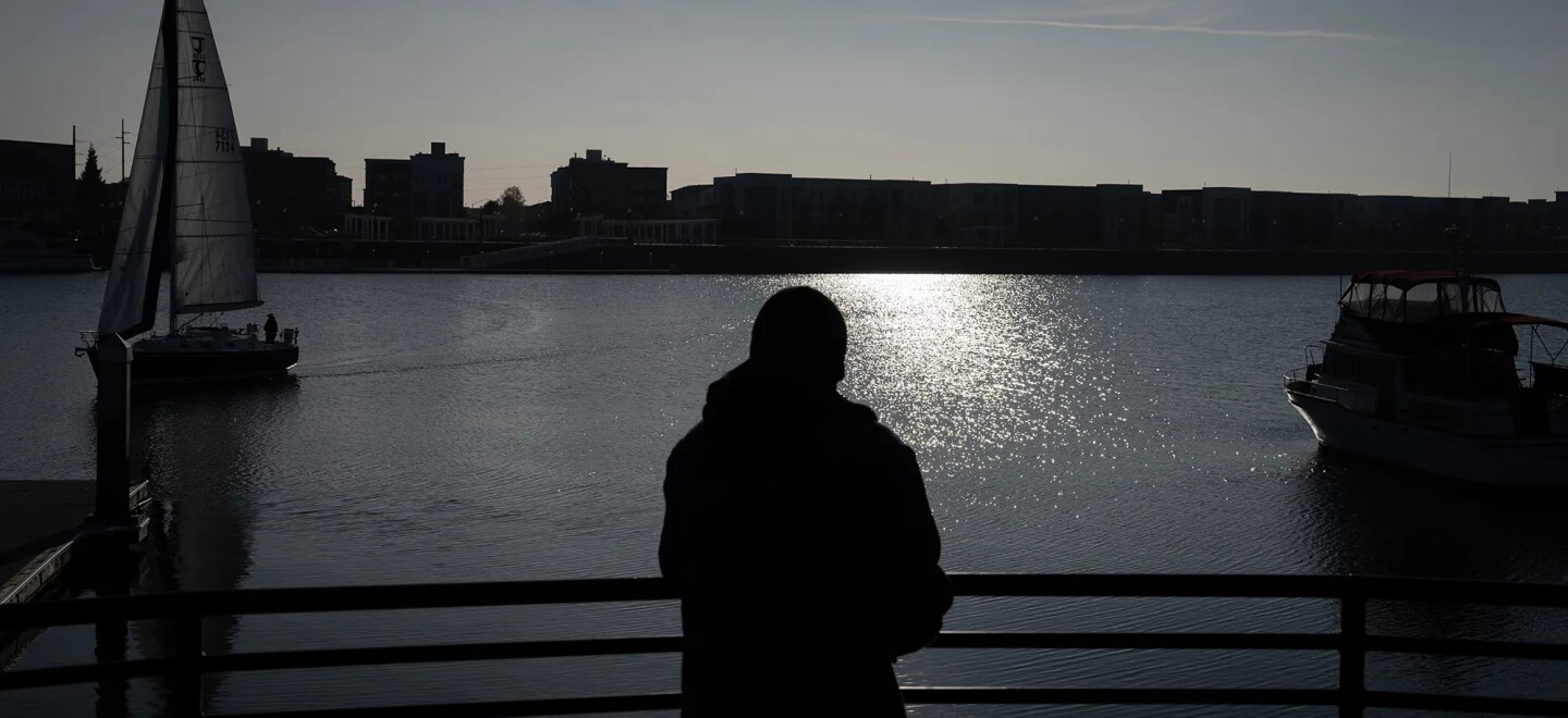 J.M., who prefers to use his initials for privacy, looks out at the San Francisco Bay at Jack London Square, where he walks almost daily for exercise and because he enjoys looking at the water, in Oakland on Dec. 1, 2025. JM received housing support through CARE Court and now lives within walking distance of Jack London.