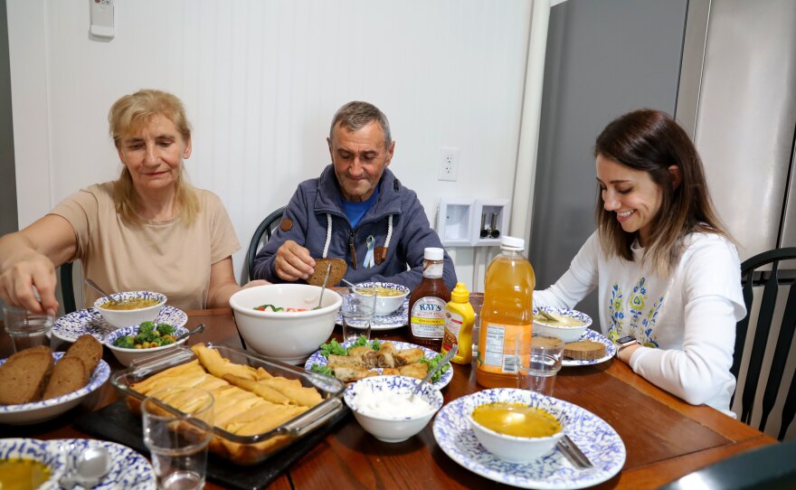 Halyna Terzi, from left, with her husband Petro and their daughter Alina, eating lunch shortly after Halyna and Petro arrived in Maine.