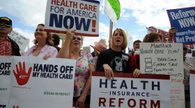 Health care reform supporters and detractors stand outside a town hall-style meeting attended by U.S. President Barack Obama in a hangar at Gallatin Field Airport on August 14, 2009 in Belgrade, Montana. 