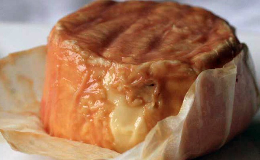 Washed-rind cheeses with orange, brownish or pink coating — like this Epoisses from France — are known for their "barnyard" odors and pungent flavors.