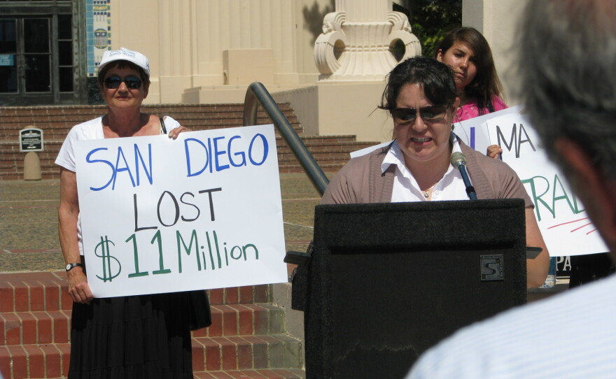 Community advocates protest outside a San Diego County Administration building onJuly 15, 2010. Protesters were reacting to the county's failure to apply for federal emergency assistance funds for welfare families. 