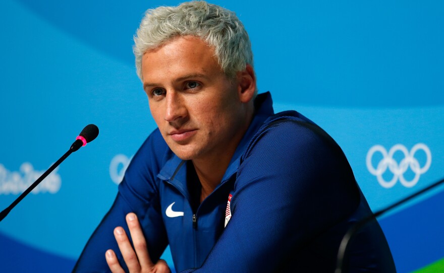 U.S. swimmer Ryan Lochte is back in the United States, his attorney tells NPR. Police in Rio want to speak to the swimmer about his story that he was robbed.