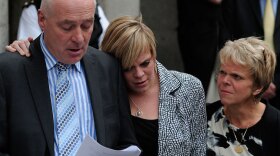 Bob Dowler, father of murdered schoolgirl Amanda (Milly) Dowler, reads a statement outside the  Old Bailey in central London on June 24. With him are Milly's mother, Sally (right), and sister, Gemma.