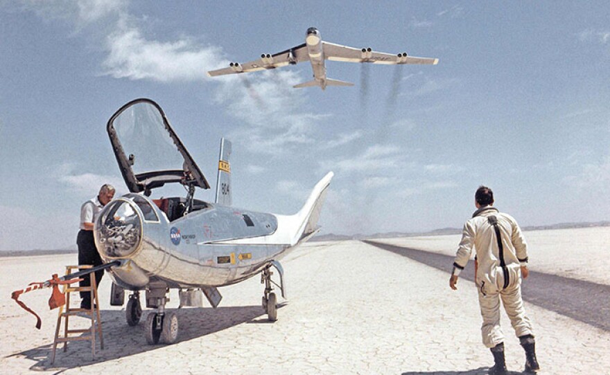BLUE SKY METROPOLIS hero art. An HL-10 on dry lakebed with B-52 flyby, c. 1966