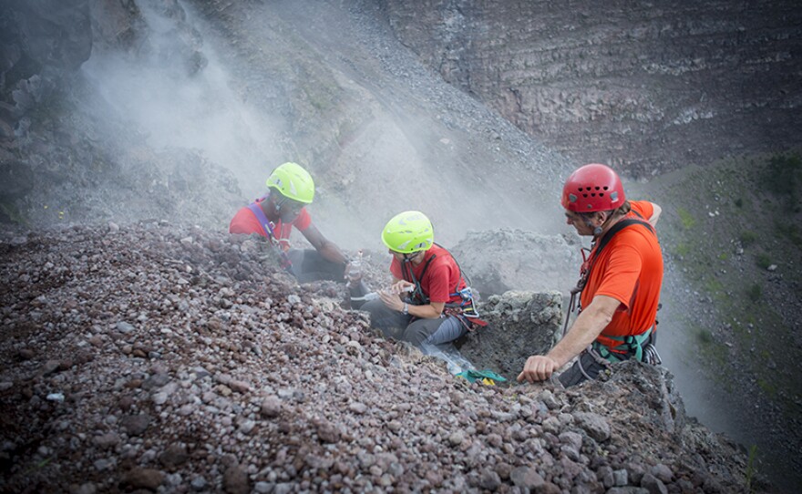 Chris Jackson, Rosanna D'Arienzo and Berardino Bocchino collecting gases from Vesuvius crater.