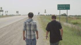 Andrew and a friend walk to buy fireworks.