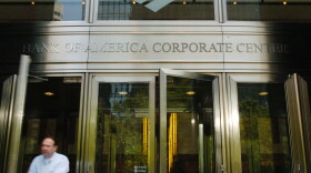 A man walks out of the the Bank of America Corporate Center June 30, 2005 in downtown Charlotte, North Carolina. 