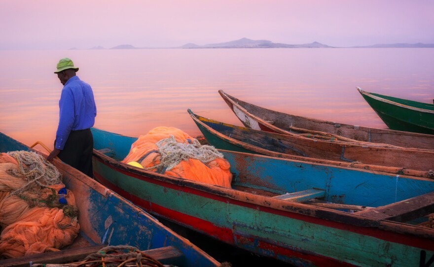 Fishing boats at sunset on Lake Victoria. They're docked on Kenya's Mfangano Island.