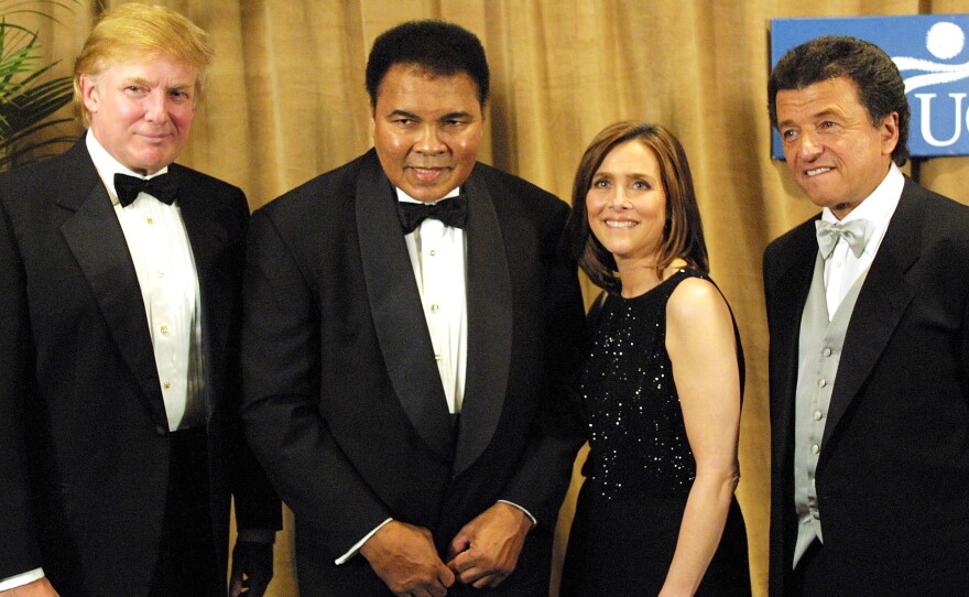 In this file photo, Muhammad Ali is honored on March 14, 2001, receiving the UCP's Humanitarian Award from Donald Trump at the United Cerebral Palsy dinner at the New York Marriott Marquis Hotel in New York City.