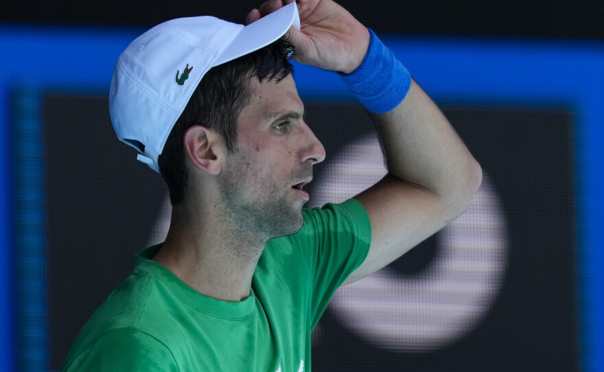 Defending men's champion Novak Djokovic practices on Margaret Court Arena on Thursday ahead of the Australian Open tennis championship in Melbourne on Thursday.