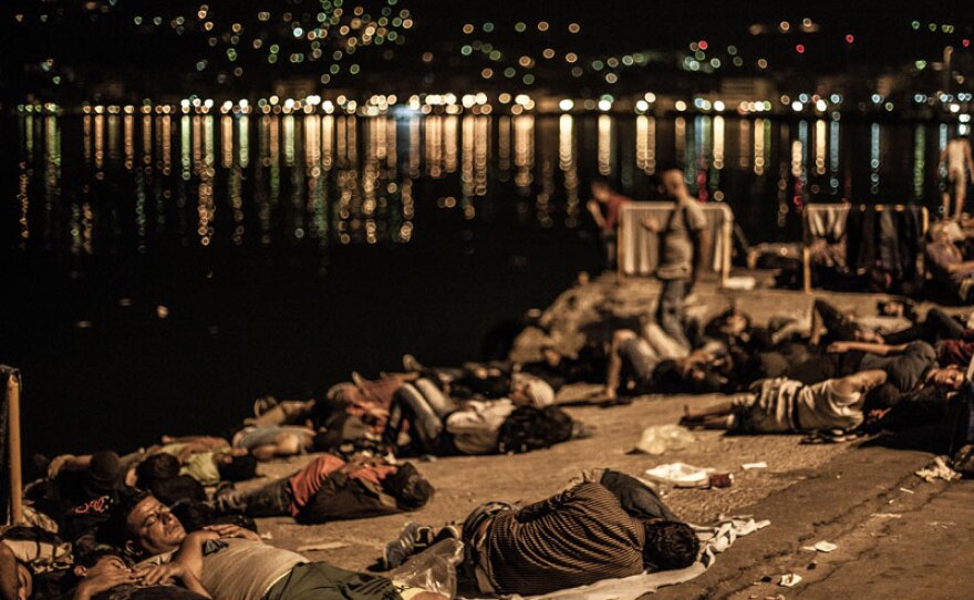 Refugees sleeping in a port in Lesbos, Greece. “Exodus” tells first-person stories of refugees and migrants fleeing war and persecution for Europe, drawing on footage filmed by the families themselves as they leave their homes on dangerous journeys seeking safety and refuge.