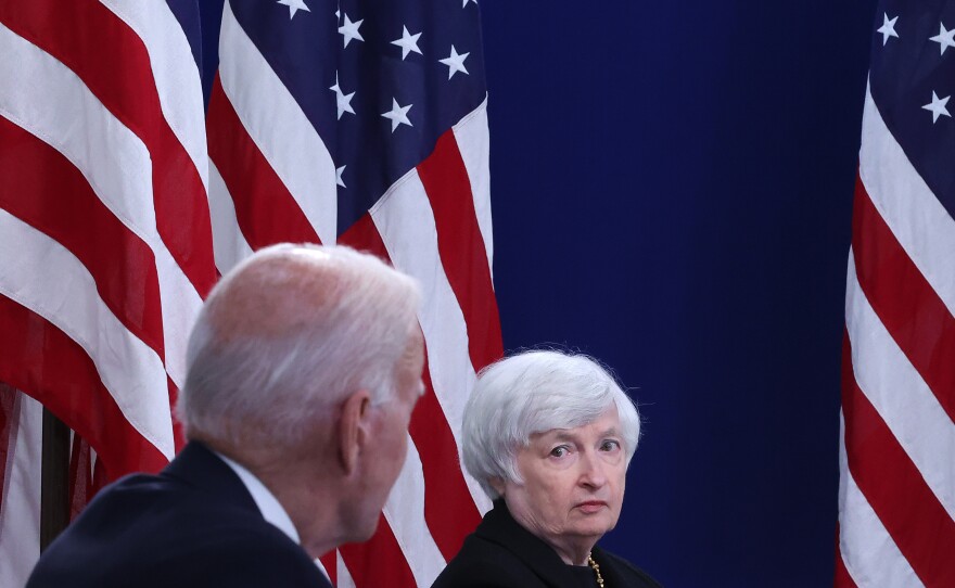 U.S. Treasury Secretary Janet Yellen listens to President Biden discuss the federal debt limit on Oct. 6, 2021, in Washington, D.C.