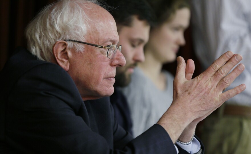 Sanders waits to speak at a town hall meeting last December in Ames, Iowa. Sanders is a socialist, but it's not a word he often uses on the campaign trail to define himself.