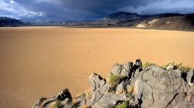 Somewhat paradoxically, ominous clouds gather above an especially barren-looking yet beautiful section of Death Valley, the hottest and driest place in the U.S. To survive, every creature there must devise ingenious ways to adapt to the environment.