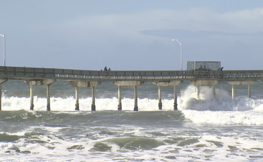 Waves crash against the Ocean Beach Pier in San Diego County. Dec. 28, 2020.