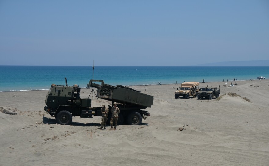 A high-mobility artillery rocket system (HIMARS) launcher sits on the beach of the La Paz sand dunes in Laoag City ahead of counterlanding exercises during annual Balikatan drills.