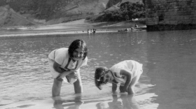 Renia Spiegel (left) and her younger sister, now known as Elizabeth Bellak, wade in the Dniester River around 1935. The photo can be seen on the cover of the published edition of <em>Renia's Diary.</em>