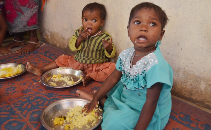 Toddlers enjoy a lunch of eggs and rice at a Fulwari in Haramar, a tribal village in northern Chhattisgarh.