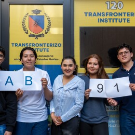 From left, students Angel Saldivar, Cesar de Leon, Miranda de Leon and Alexander Ortiz stand with Mitzi Salgado (center) outside the Transfronterizo Institute in San Ysidro on March 25, 2026.