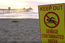 A beach closure sign is posted at Imperial Beach due to water pollution, Feb. 13, 2017.