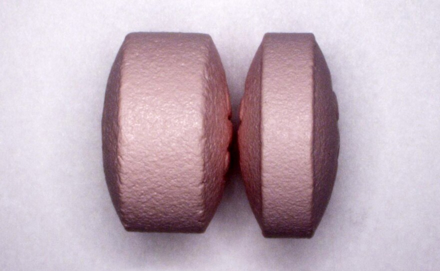 A reformulated OxyContin pill (left) releases its active ingredient over time, but an added polymer makes it difficult to crush, melt or prepare for injection. When heated, the polymer forms a viscous gel that binds the active ingredient.