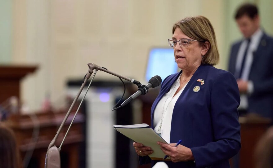 Assemblymember Cecilia Aguiar-Curry speaks to other lawmakers during an Assembly floor session at the state Capitol in Sacramento on Oct. 1, 2024.