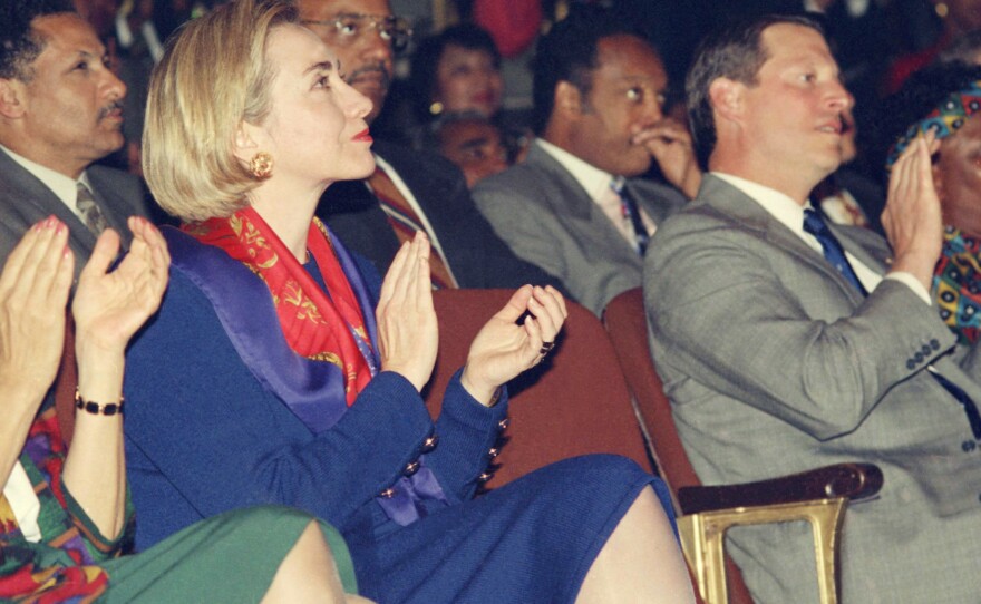 United States First Lady Hillary Rodham Clinton, left, and Vice President Al Gore applaud during a variety musical performance of  "Sophiatown"  by members of the Market Theatre Company on Monday, May 9, 1994 in Johannesburg. Rev. Jesse Jackson is seated behind Gore.
