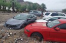 Cars are stuck in mud and debris from flash flooding at The Inn at Death Valley in Death Valley National Park in California on Friday.