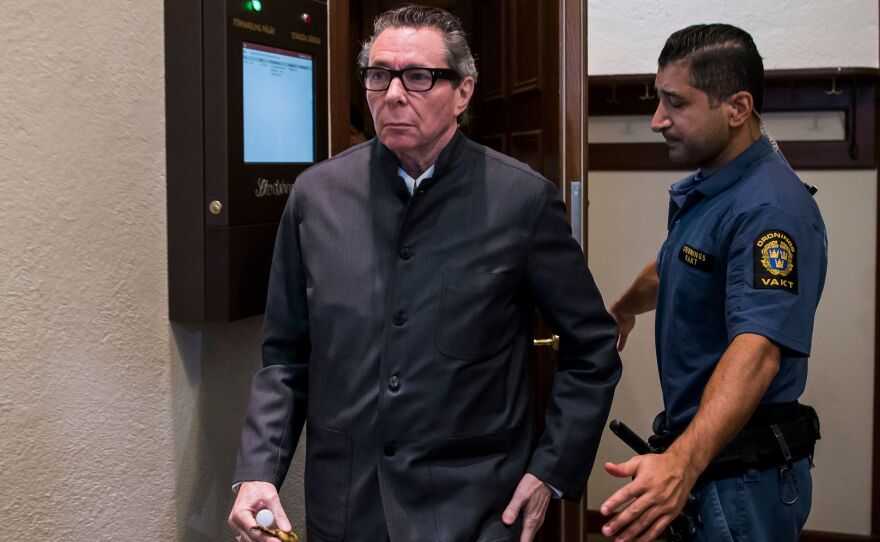 A court in Stockholm has found cultural figure Jean-Claude Arnault guilty of rape. He's seen here leaving on the final day of hearings in his trial. The turmoil unleashed by the case prompted the Swedish Academy to postpone this year's Nobel Literature Prize.