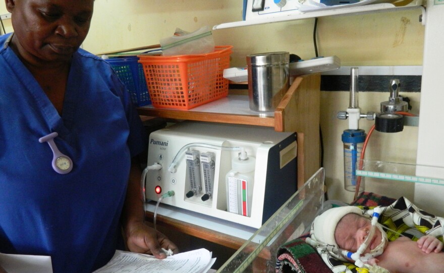 Neonatal nurse Florence Mwenifumbo monitors a newborn receiving bubble CPAP treatment in Blantyre, Malawi. The device was developed by students at Rice University in Houston.