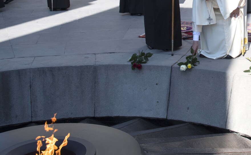 Pope Francis places flowers during his visit to Tzitzernakaberd Memorial Complex in Yerevan, Armenia, on Saturday.