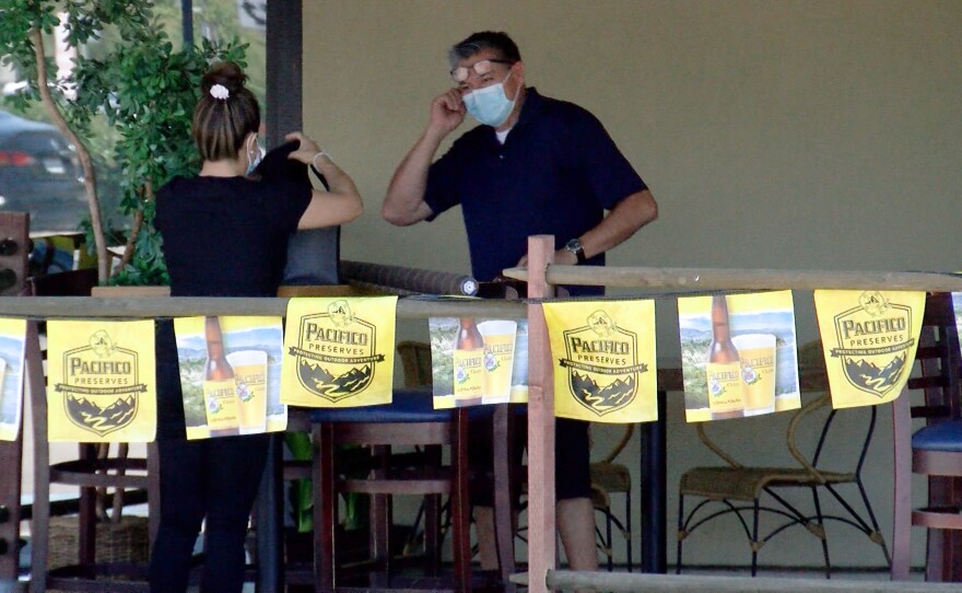 Juan Magana of Sierra Madre Cantina in Escondido puts the finishing touches on his new outdoor "patio," July 8, 2020.