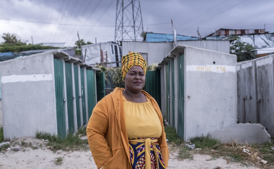 Zukwisa Qeso, who works for the Social Justice Coalition and is the head of her street committee, photographed near her home in the township of Khayelitsha, Cape Town, where she helps raise awareness about COVID-19.