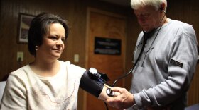 Physician assistant Tom Harward takes a patient's blood pressure in an exam room at the Belington Clinic, a community health center in Belington, W.Va. Across the U.S., state officials like the amount of increased federal spending in the new health care law, but they are wary of how high their own costs will be and how much heavier their workload is about to become.