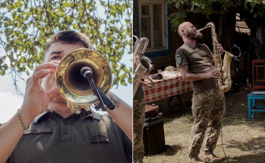 One band member plays a trumpet and another plays a saxophone in their Cultural Forces performance in eastern Ukraine's Donbas region.