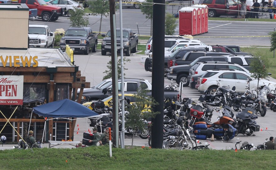 Law enforcement investigate on May 18 the motorcycle gang-related shooting at the Twin Peaks restaurant in Waco, Texas.