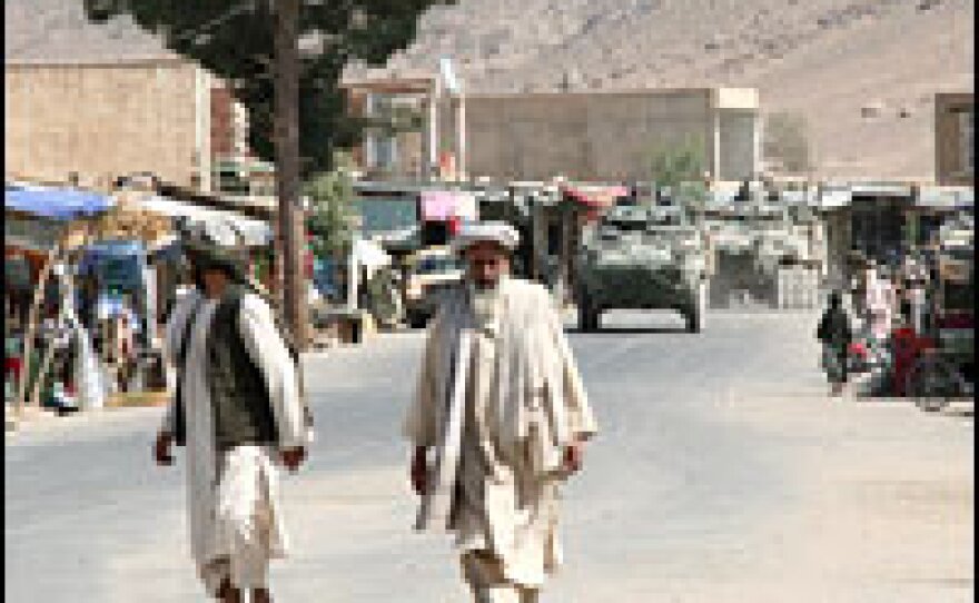 These NATO convoys are a familiar sight in the village of Panjwai. The district's assistant police chief says he doesn't have enough policemen to keep the peace without international forces and the Afghan National Army.