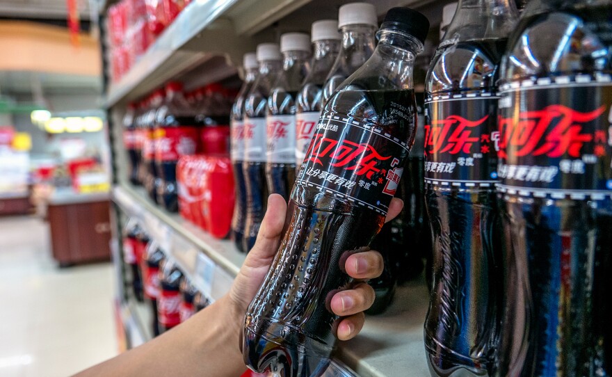 Diet Coke for sale in a Chinese supermarket. A new World Health Organization report recommends that nations adopt fiscal policies, including taxes, that raise the retail price of sugary drinks to fend off obesity and diabetes — and the health care costs that go with them.