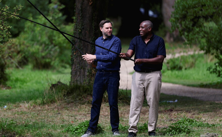 Britain's Foreign Secretary David Lammy, right, and US Vice President JD Vance fish in a lake in the grounds of Chevening House in Kent, England, Aug. 8, 2025.