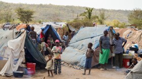 Children play among the tents of Parc Cadeau, one of the camps set up in Haiti for migrants who've left the Dominican Republic after being stripped of their citizenship.