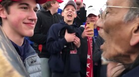 Nick Sandmann, a student from Covington Catholic High School, stands in front of Nathan Phillips, a Native American, at the Lincoln Memorial in Washington, D.C.
