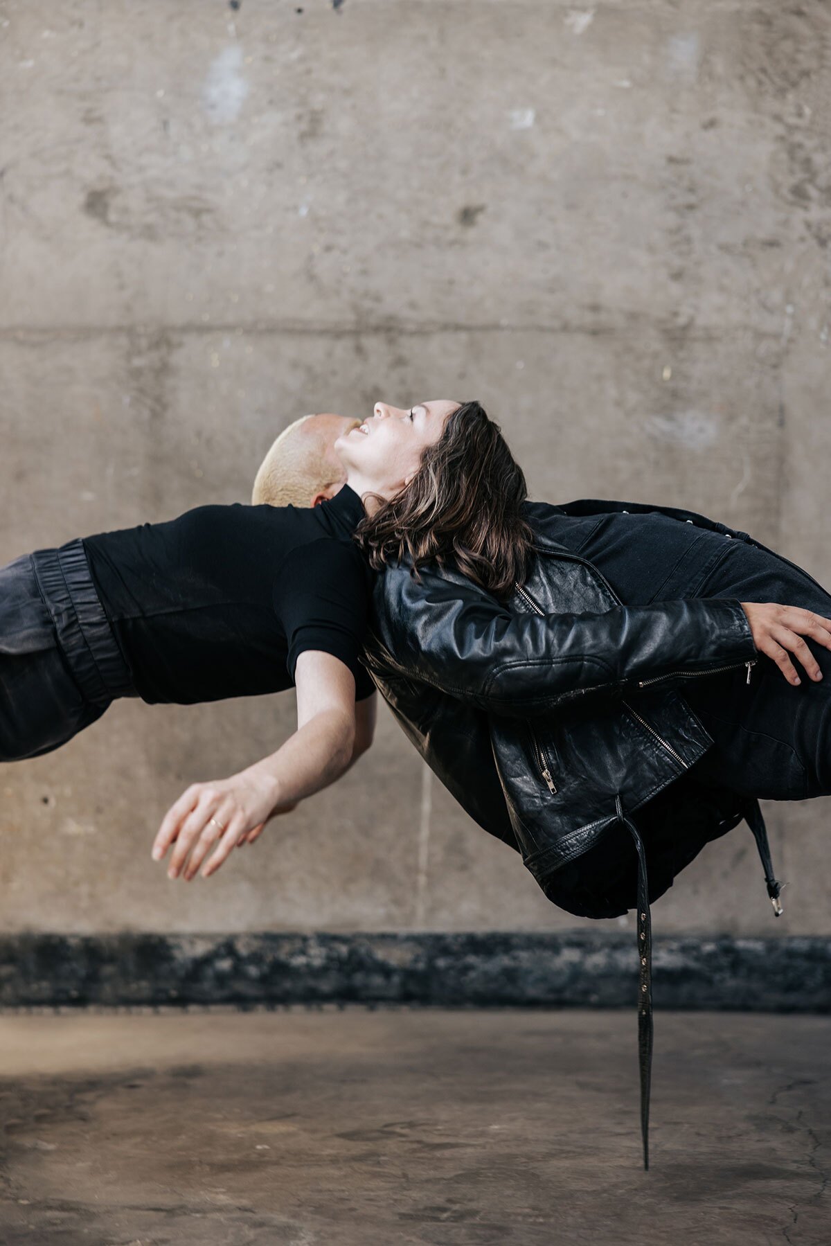 Two Disco Riot dancers appear to levitate in a still from Chelsea Zeffiro's "Girldream (1996)"