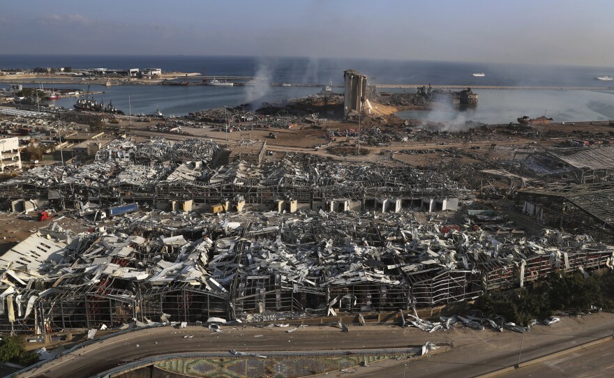 An aerial view of Beirut's port one day after a massive explosion rocked the Lebanese capital.  Tuesday's blast flattened much of the city's port and damaged buildings across the city.
