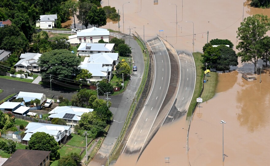 In an aerial view Sunday, floodwaters surround the town of Gympie, Australia, in an area north of Sunshine Coast.