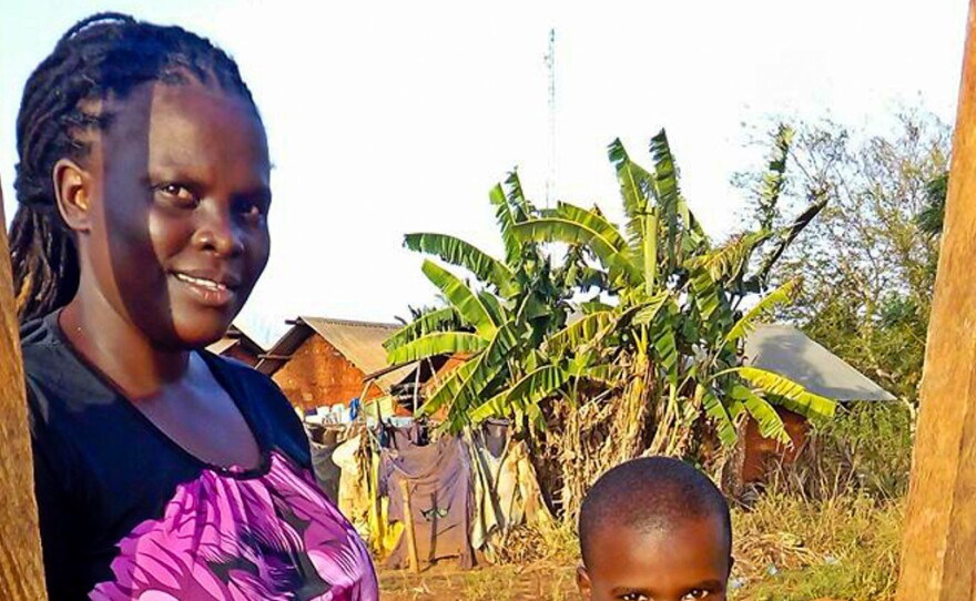 Faith and her son, William, are ready to plant some coriander seeds.