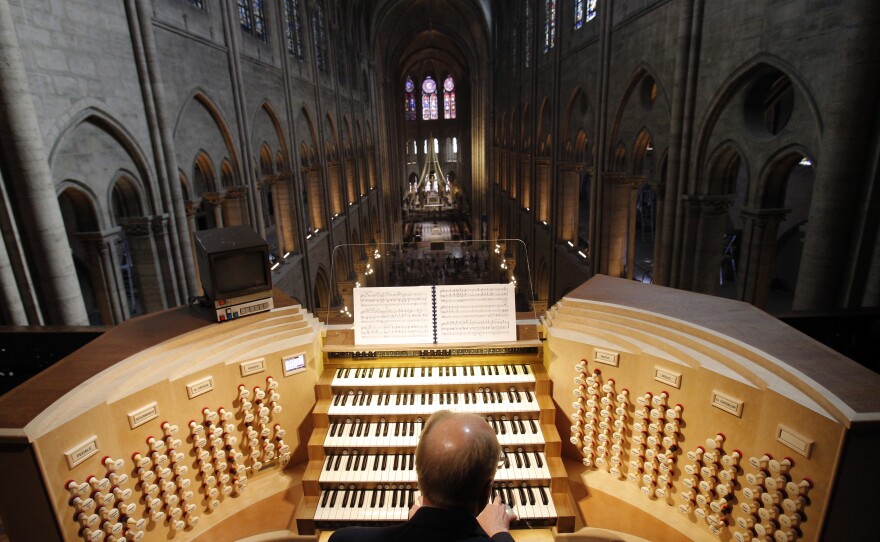 Organist Philippe Lefebvre plays at Notre Dame in 2013. Sophie Benn, a musicologist at Case Western Reserve University, says the acoustics of the cathedral are "baked into the DNA of classical music."