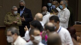 Cuban President Miguel Díaz-Canel, top, second from left, follows former President Raúl Castro inside the National Assembly in Havana, Cuba, on Wednesday, October 28, 2020.
