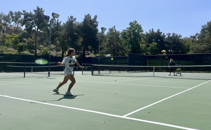 Youth tennis player Alice Martinez steps up to hit a forehand on a Rancho Peñasquitos tennis court on July 11, 2025.