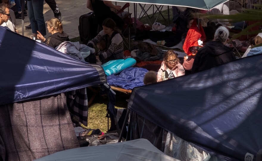 Hundreds of Ukrainian war refugees have set up a make-shift camp in Tijuana while they wait in line for up to three-days to claim asylum in the United States, April 1, 2022.